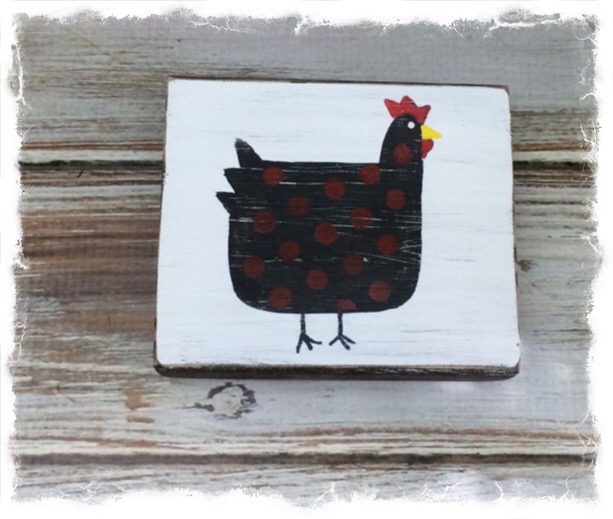 country chicken on vintage wood block 