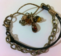 Brass and leather charm bracelet