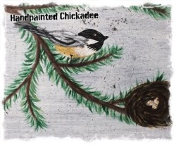 a couple of chickadee's handpainted on a wooden block