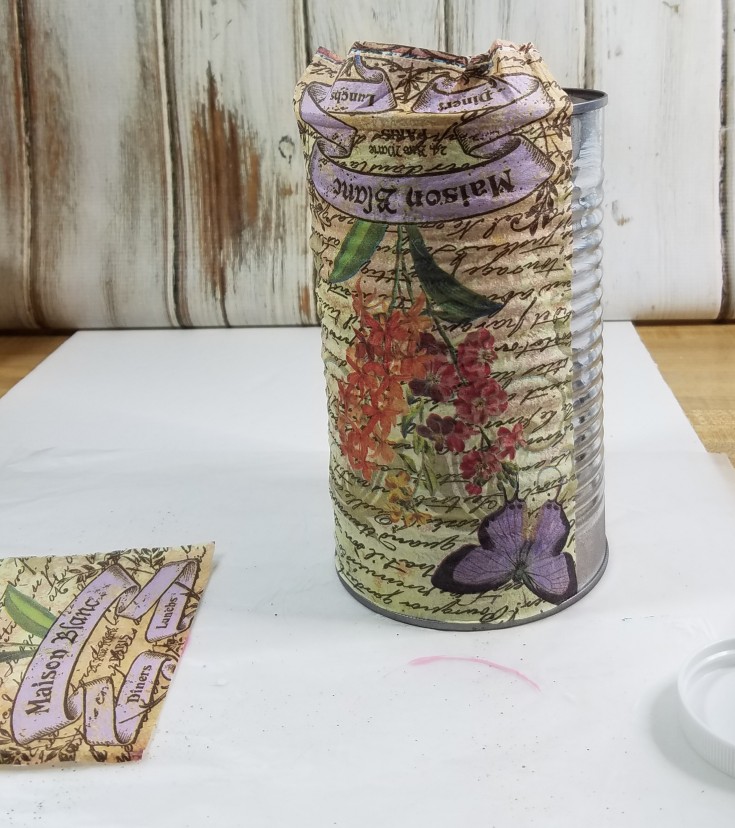 Decoupaged tin can