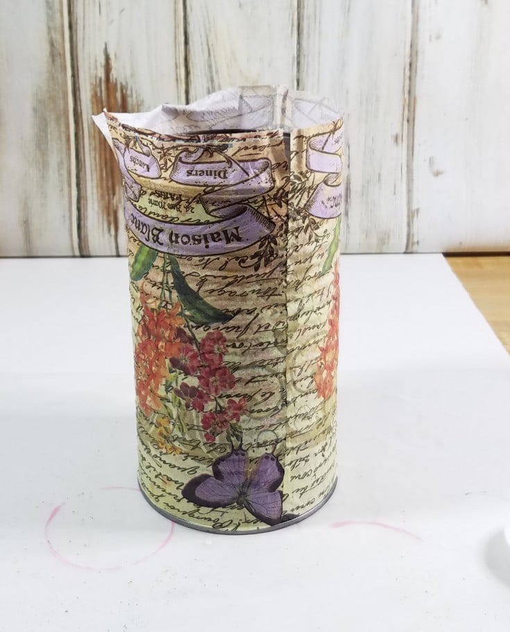 Decoupaged tin can