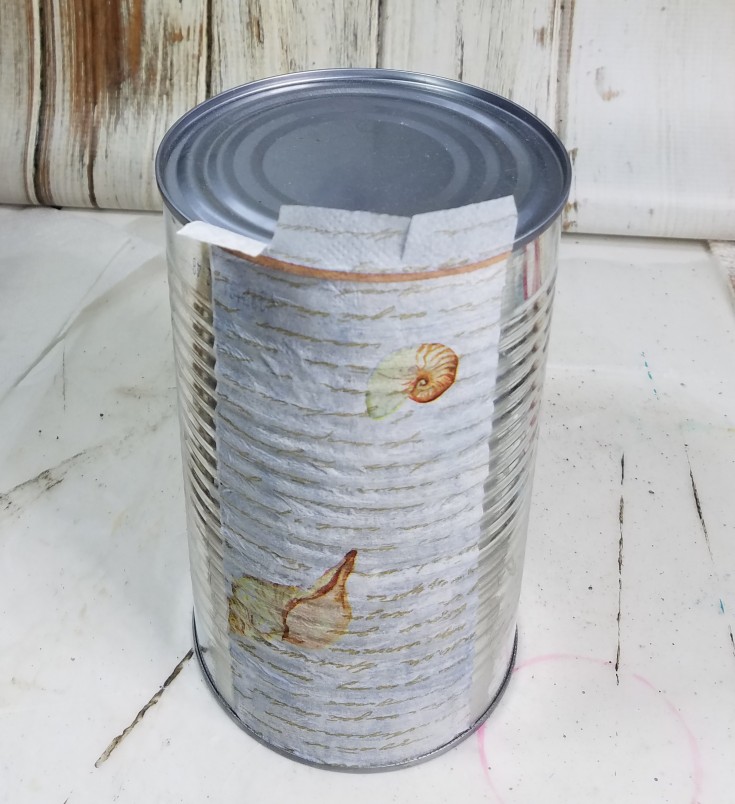 Decoupaged tin can