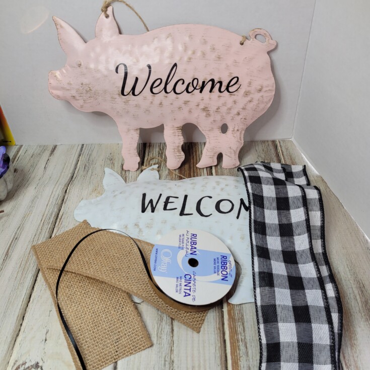 Welcome signs made from Dollar Tree pigs