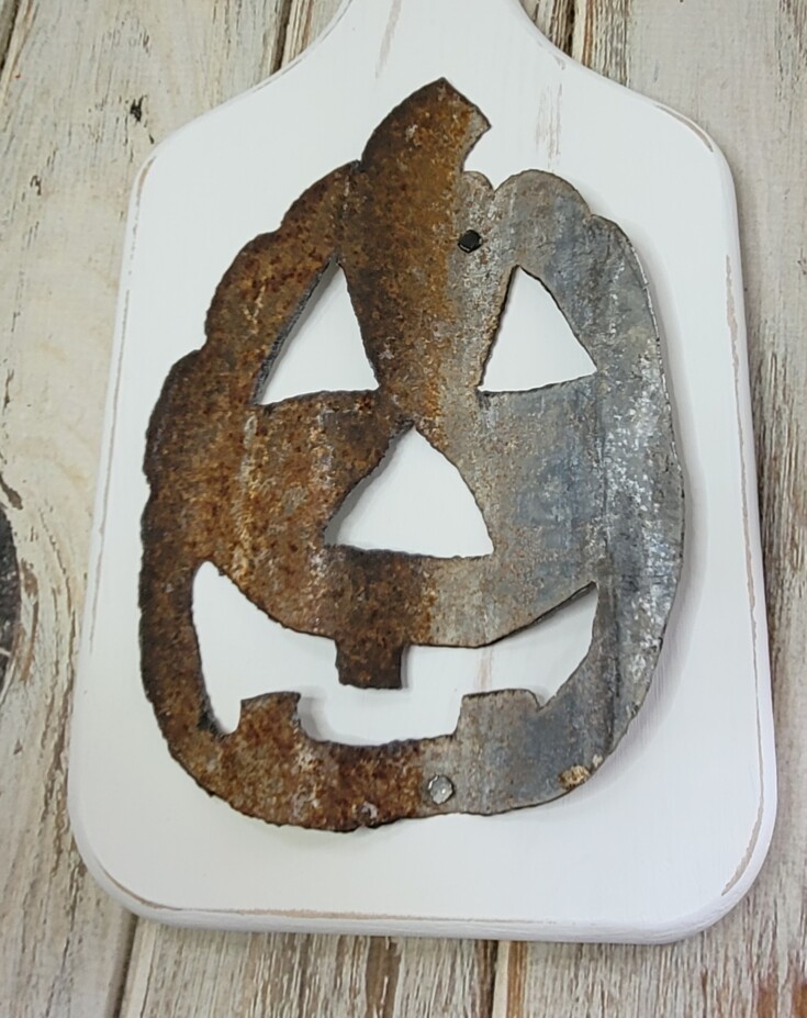 Tack on a metal jack-o-lantern